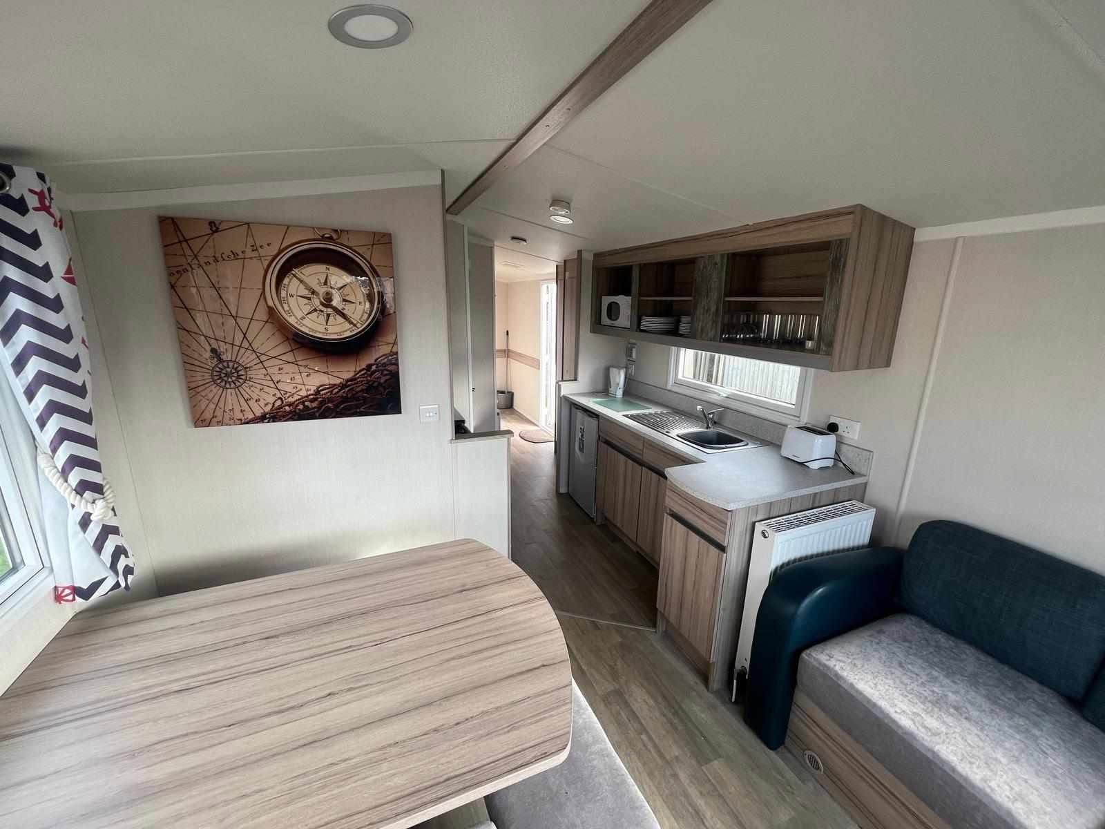 Rossall Court lounge and kitchen with compass artwork